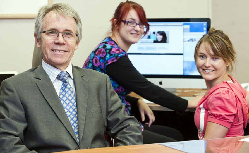 USQ acting vice-chancellor Professor Graham Baker checks out the MyUniversity website with students Mikayla Johnson (left) and Kelly-Ann Tester. USQ acting vice-chancellor Professor Graham Baker checks out the MyUniversity website with students Mikayla Johnson (left) and Kelly-Ann Tester.